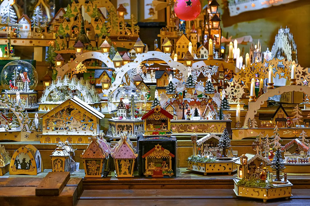 Illuminated wooden decorations, candle arches and snow globes at a stall of the Christkindelsmärik